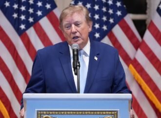 Trump puts new Russia sanctions passed by Congress on hold, saying waiver is in US national interest