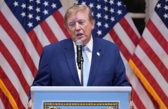 Trump puts new Russia sanctions passed by Congress on hold, saying waiver is in US national interest