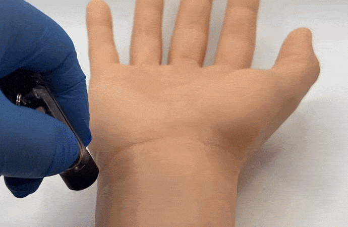 Watch this invisible tattoo appear under UV light