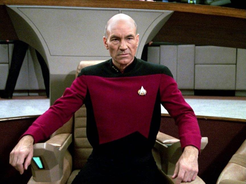 Patrick Stewart as Jean-Luc Picard on the bridge of the Enterprise in Star Trek: The Next Generation.