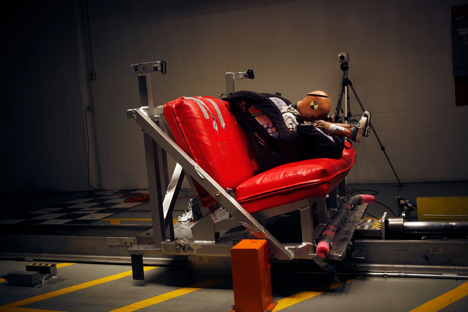Car seat crash test with small child dummy.