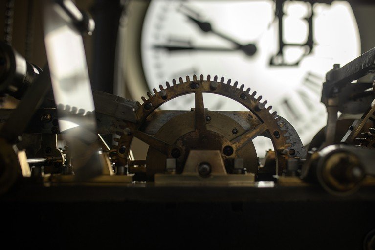 Close-up view of the clock mechanism in a mechanical clock.