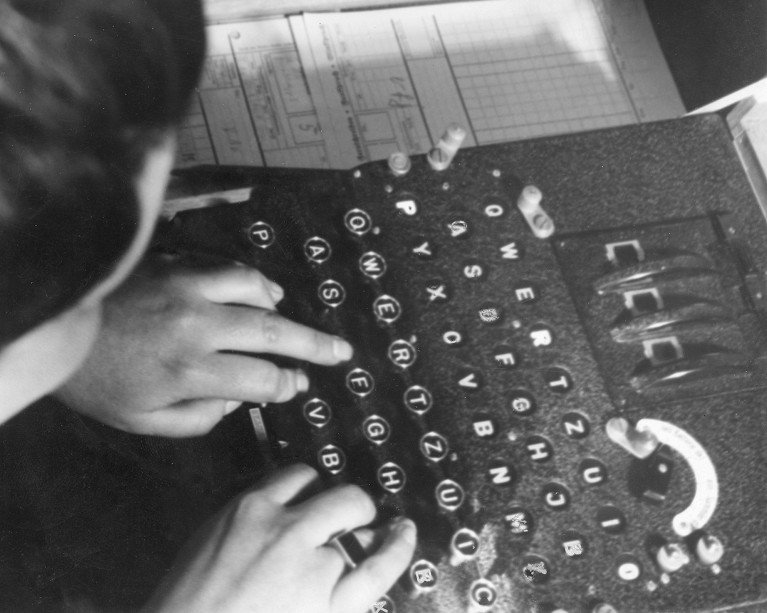 People code radio signals and messages while constantly change the code with the Enigma machine, 1943 .