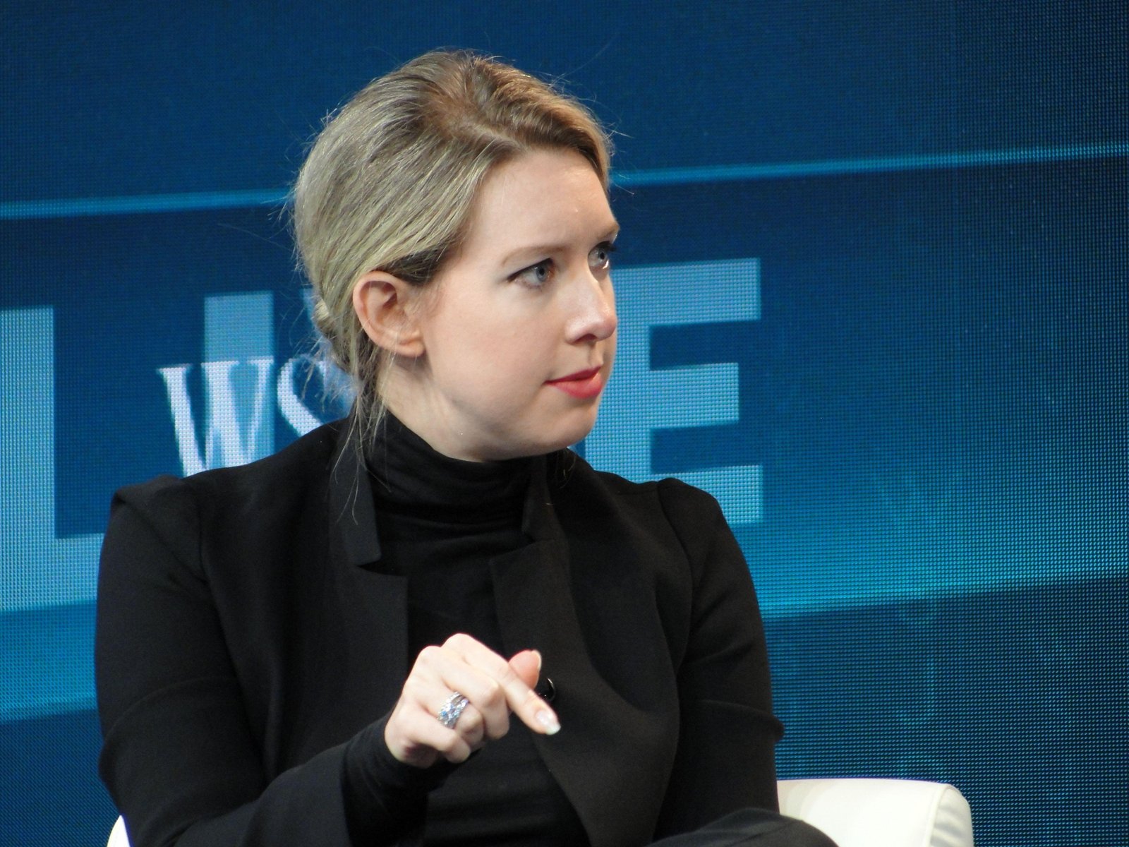Theranos chief executive Elizabeth Holmes gestures as she speaks at a Wall Street Journal technology conference in Laguna Beach, California on October 21, 2015. The founder of innovative blood test startup Theranos challenged The Wall Street Journal on its own turf about an investigation into the firm’s technology. Elizabeth Holmes took to the stage at the prestigious WSJDLive technology conference on the Southern California coast to say the Journal got the story wrong. AFP PHOTO/ GLENN CHAPMAN (Photo by GLENN CHAPMAN / AFP) (Photo credit should read GLENN CHAPMAN/AFP via Getty Images)