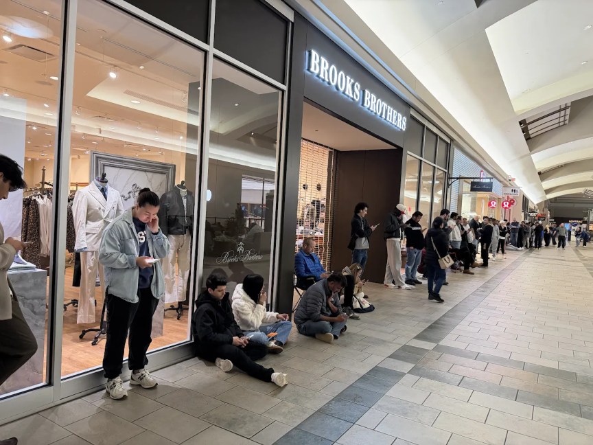 A long line formed inside the Oxmoor Center in Louisville, Kentucky for people planning to buy the iPhone Duo when stores open.