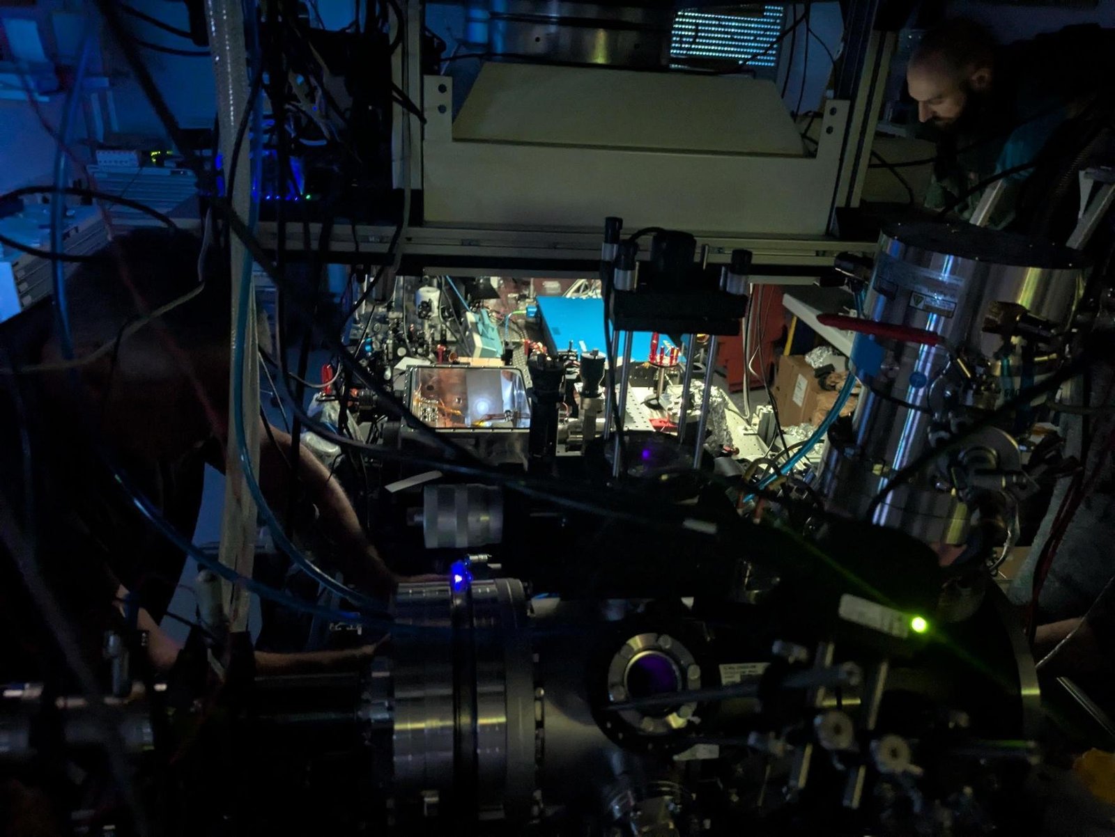 a team working on a clock in a lab